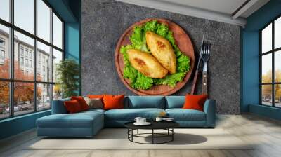 PERUVIAN CHILEAN traditional dish PAPA RELLENA meat stuffed mashed potato on wooden plate Wall mural