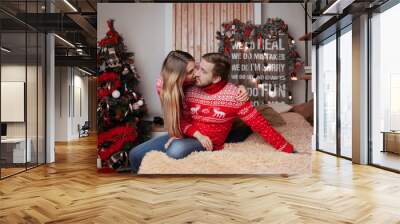 couple in love in red sweaters in the Studio, new year and Christmas Wall mural