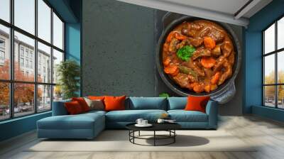 Beef stew in Burgundy. With carrots, onions, peas and champignons in wine. View from above. Wall mural