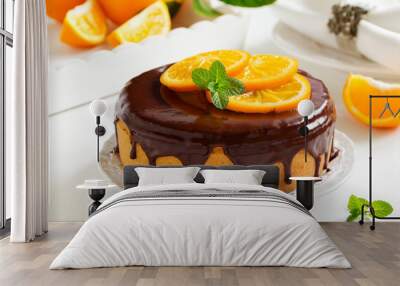 orange cake with chocolate and orange slices. Wall mural