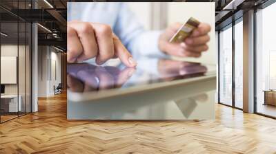 Man holding tablet pc and credit card indoor, Shopping online Wall mural