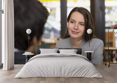 portrait of beautiful woman with a man in restaurant Wall mural