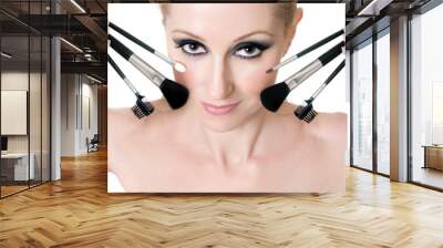 female face with cosmetic makeup brushes Wall mural