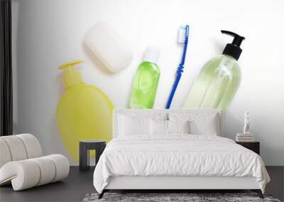 Soap packing, sanitizer gel in green bottle and toothbrush. Cosmetic products, toiletries for hygiene Wall mural