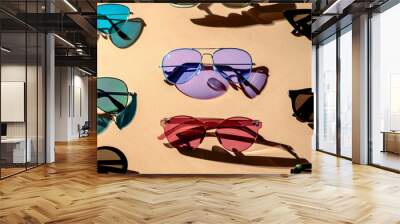 Variety of sunglasses over colorful background	 Wall mural