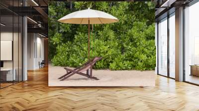 Beach chairs under a cream umbrella on the fine beach. Relax and vacation concept. Wall mural