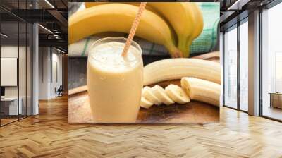 banana smoothie on a rustic wooden table Wall mural