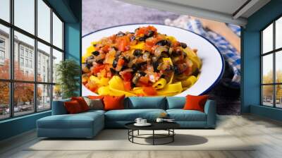 Traditional pasta with black olives and tomato Wall mural