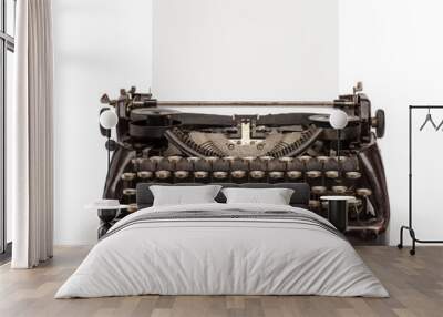 Old vintage typewriter and a blank sheet of paper inserted. Isolated on white background. Wall mural