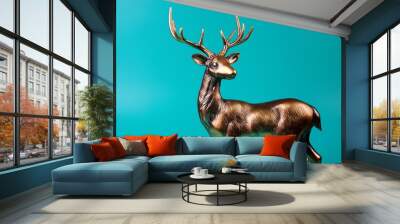 beautiful and traditional british deer stag bronze or alloy statue or sculpture cut out against a turquoise background Wall mural