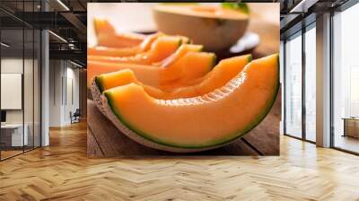 fresh and juicy melon slices on a rustic wooden table perfect for summer recipes and healthy snacks Wall mural