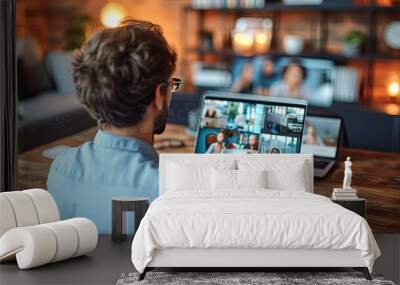 Man in Casual Attire Attending Online Meeting from Modern Living Room Wall mural