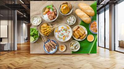 Vietnamese food background with spring roll, banh mi, banh canh, steamed fish ball, shrimp dumpling. Typical cuisine of south central of Vietnam like Binh Thuan, Ninh Thuan, Nha Trang province Wall mural