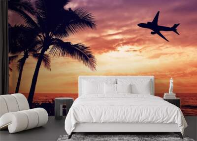 Tropical sunset with palm tree and airplane silhouettes in Hawaii. Travel and vacation concept.  Wall mural