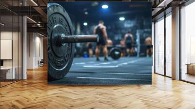 Gym Atmosphere: Close-up of Dumbbells in a Bustling Gym Setting Wall mural