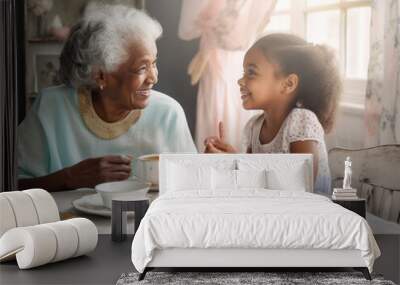 Close-up portrait of a black grandmother and young granddaughter having tea. They are looking at each other, talking together, and smiling.  Illustration created with Generative AI technology. Wall mural