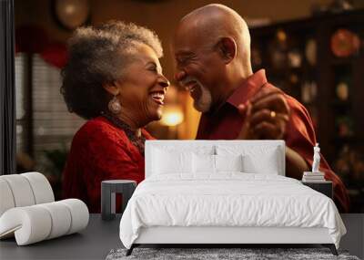 Elderly African American couple slow dancing in their living room.  Closeup with focus on their smiling faces.   Wall mural