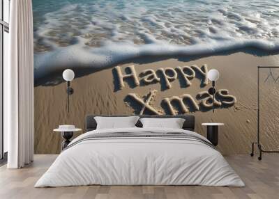 the words Happy Xmas written in the sand Wall mural