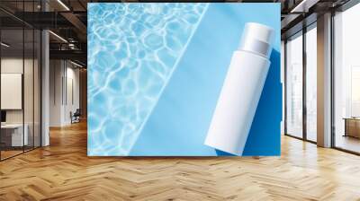 Mockup of cosmetic packaging. Cosmetic moisturizer with hyaluronic acid, micellar emulsion on blue swimming pool water background. Wall mural