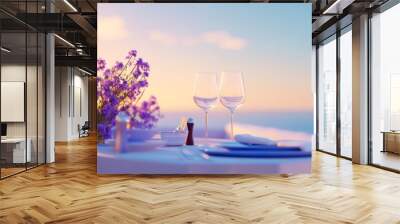 A table for two adorned with elegant glassware and flowers overlooks a sunset Wall mural