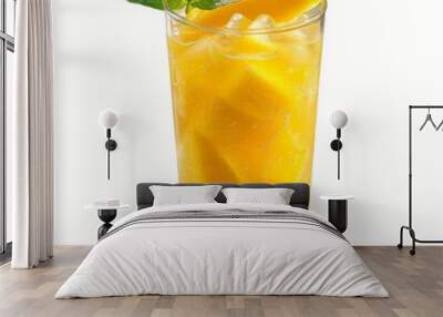 A tall glass filled with mango lemonade, ice, and a sprig of mint Wall mural