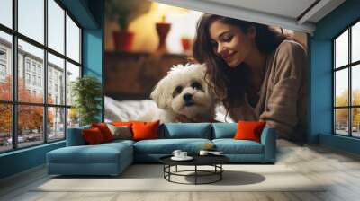 Young woman playing with her dog indoor, looks like they're talking together Wall mural