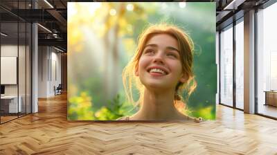 Close-up portrait of happy woman in natural park. Wall mural