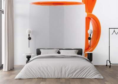 Orange coffee mug and spoon on modern white backdrops. Empty tea cup for your design. Wall mural