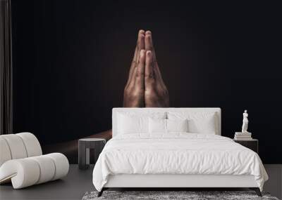 Praying hands with faith in religion and belief in God on dark background. Power of hope or love and devotion. Namaste or Namaskar hands gesture. Prayer position. Wall mural