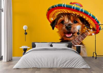 small red terrier dog in a Mexican traditional sombrero hat playing the guitar ukulele on a bright yellow orange background copy space Cinco De Mayo holiday Funny pets Wall mural