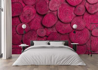 Background of heap fresh colorful beetroot slices Wall mural