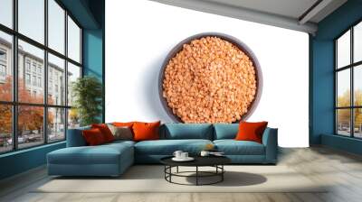 Dried red lentils in a wooden bowl isolated on white Wall mural