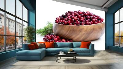 Fresh cranberries in wooden bowl isolated on white Wall mural