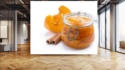 Marinated pumpkin slices in a glass jar isolated on white Wall mural