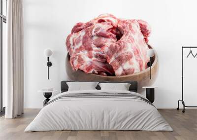 Raw pork ribs in wooden bowl isolated on white background Wall mural