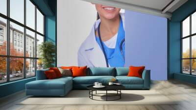 A female doctor with a blank billboard. Woman doctor Wall mural