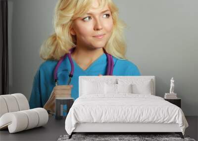 Closeup portrait of a female doctor with stethoscope Wall mural