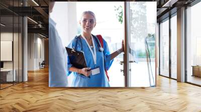 Doctor meeting with patient in hospital office Wall mural