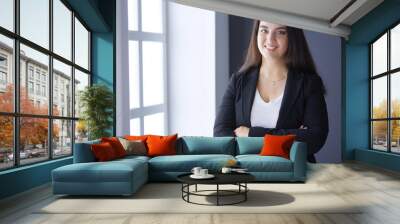 Modern business woman standing in the office Wall mural