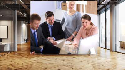 Business meeting -  manager discussing work with his colleagues Wall mural