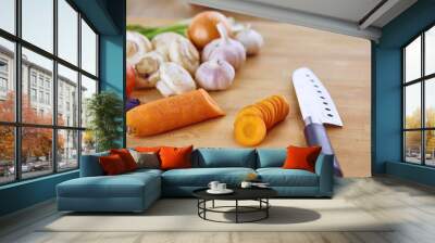 Composition with wooden board and ingredients for cooking on ta Wall mural