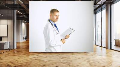 Young confident doctor in a white coat with a stethoscope Wall mural