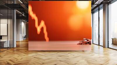 A vivid image of coins stacked on a table, set against the backdrop of a stock market graph. The scene represents financial dynamics and economic trends. Wall mural