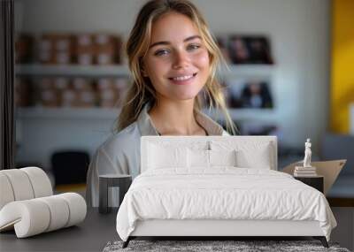 Confident female in office casual attire smiling in a professional workspace with blurred background Wall mural