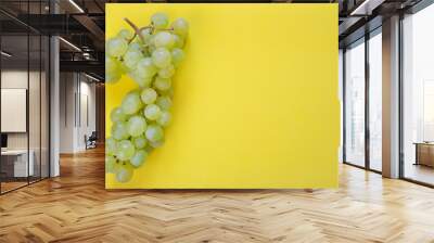 green grapes on yellow background with copy space Wall mural