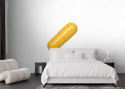 three yellow capsules or pills isolated on white background Wall mural