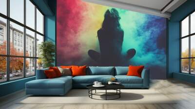 Abstract figure in meditation surrounded by swirling rainbow clouds symbolizing the flow of creative energy balance and the connection to the universe in a surreal radiant environment Wall mural