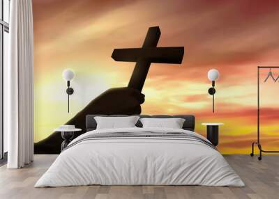 Human hand holding Christian cross Wall mural