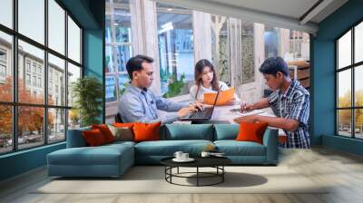 Man and woman business colleagues discussing a business project plan during a meeting Wall mural