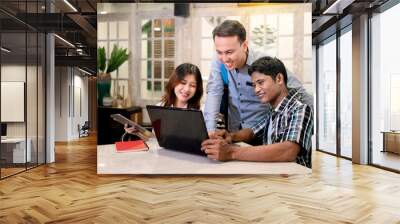 Portrait of multiethnic business colleagues discussing a business project plan during a meeting Wall mural